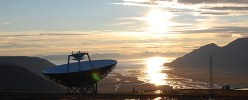 Satelite dish with water delta and mountains in the background